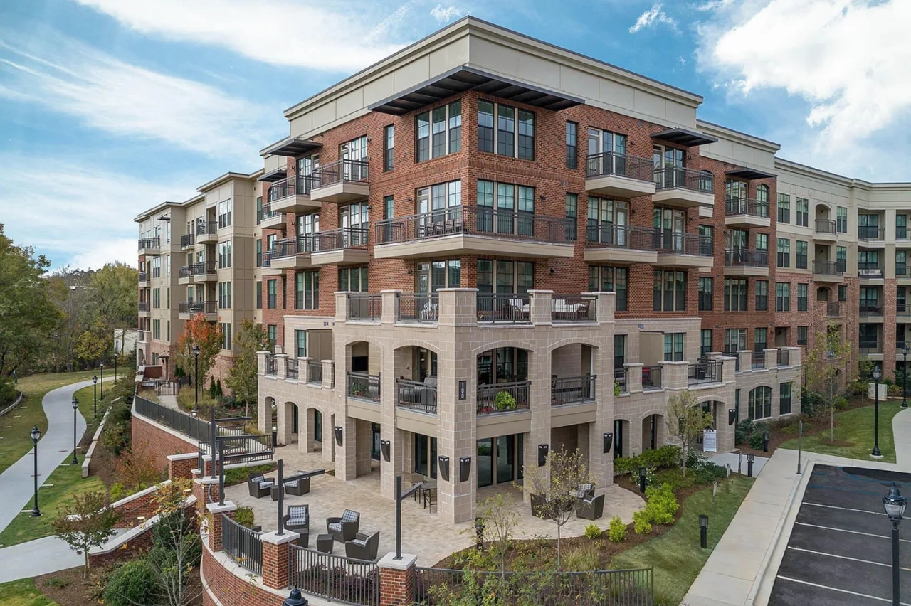 Modern brick apartment complex with balconies.